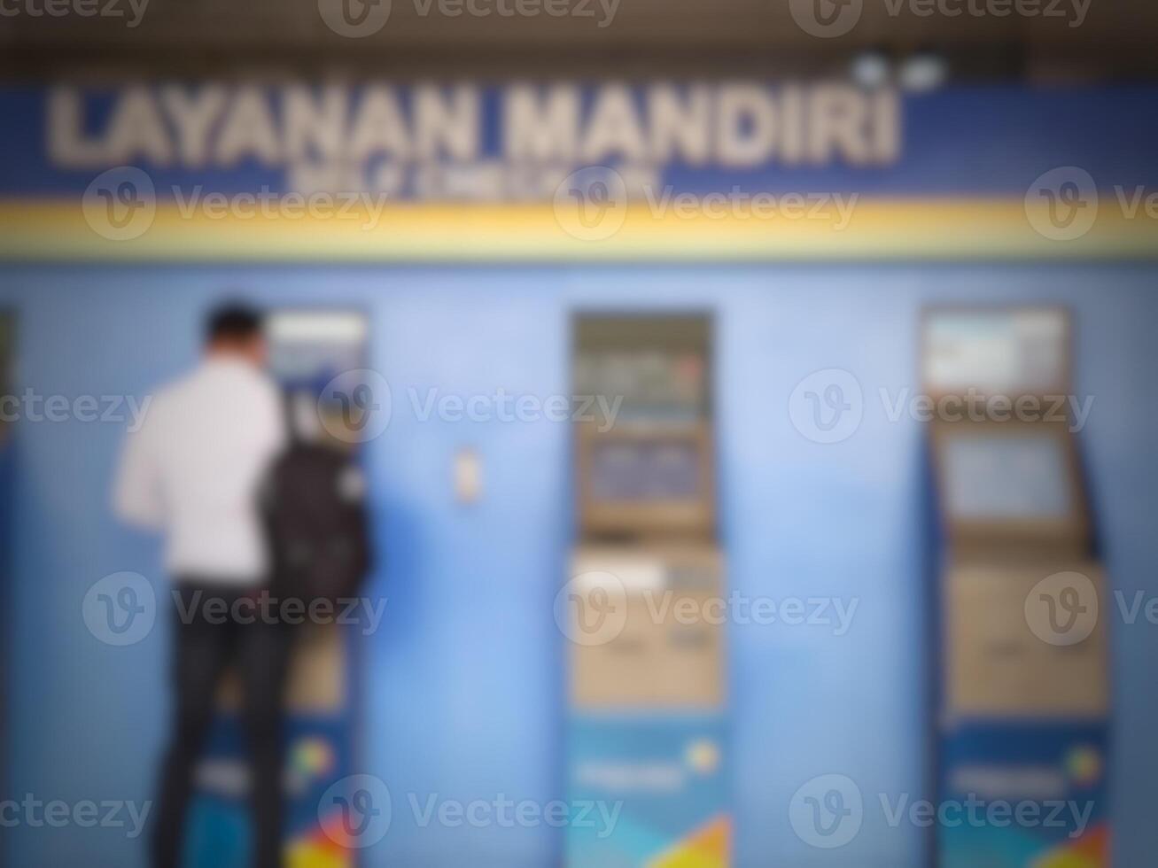 Jakarta, Indonesia on July 7 2022. Defocused photo or blurred photo of an airplane passenger who is self-checking in at the machine available at Halim Perdanakusuma Airport.