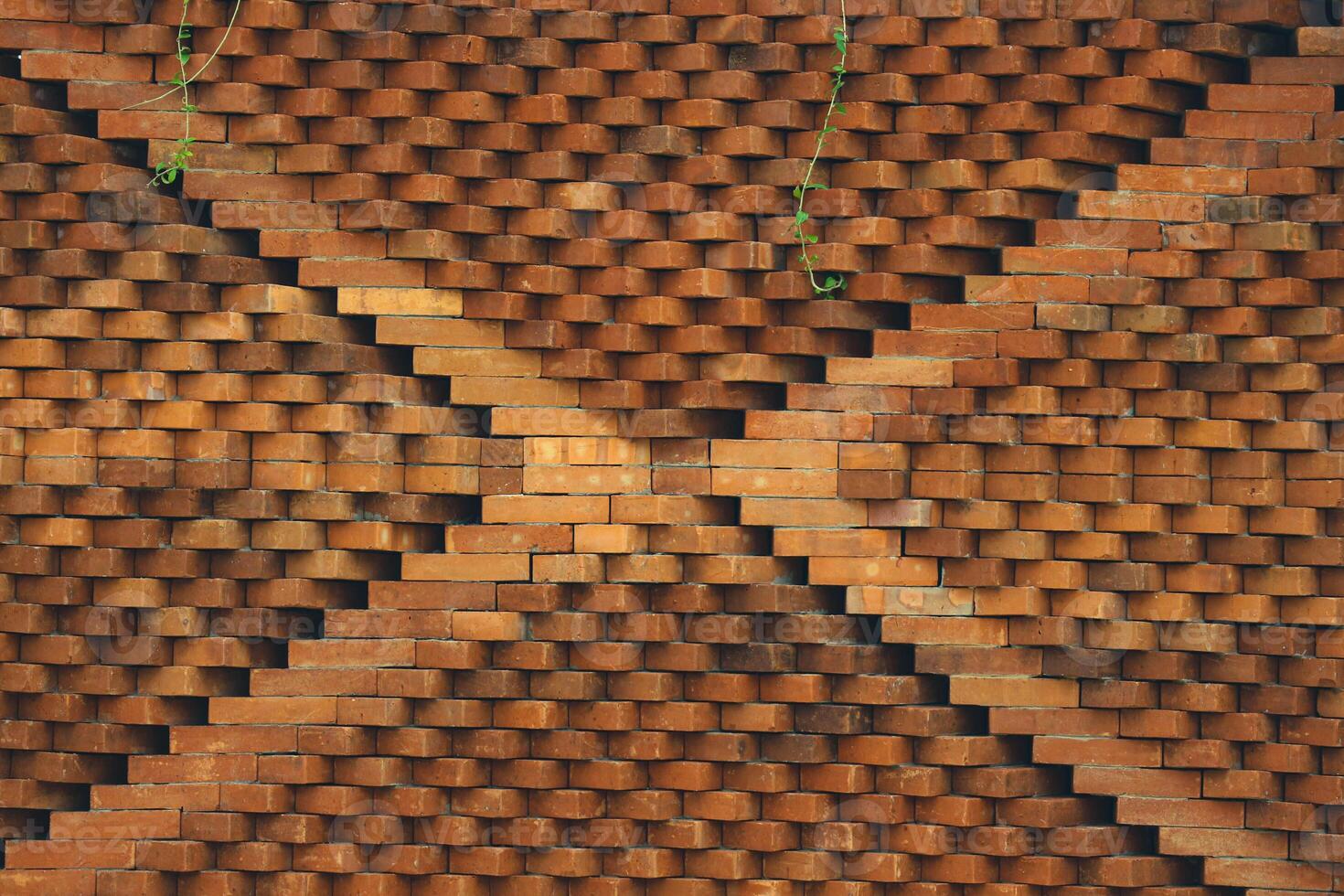 The arrangement of the bricks arranged in such a way forms a very beautiful building wall photo