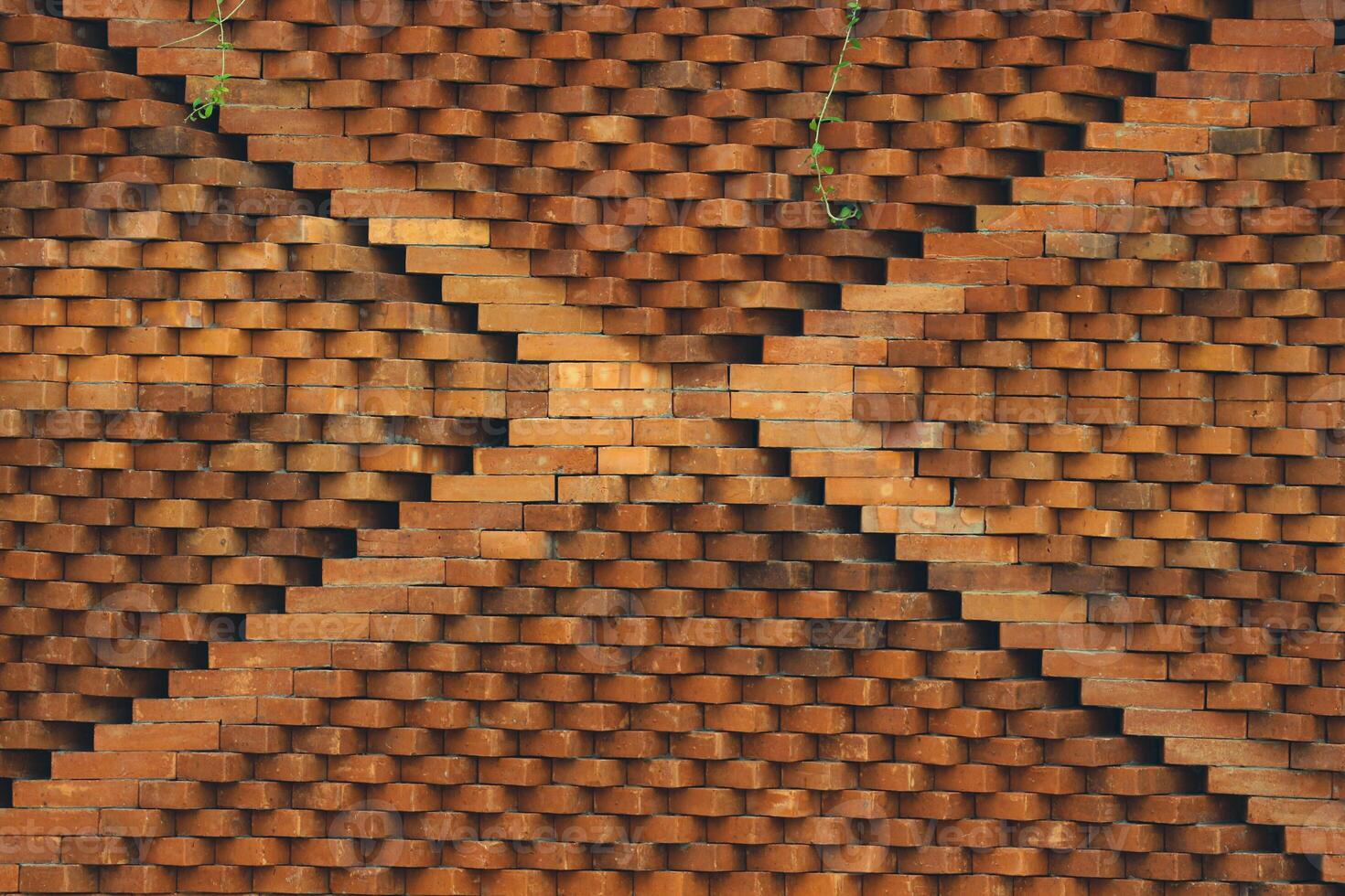 The arrangement of the bricks arranged in such a way forms a very beautiful building wall photo