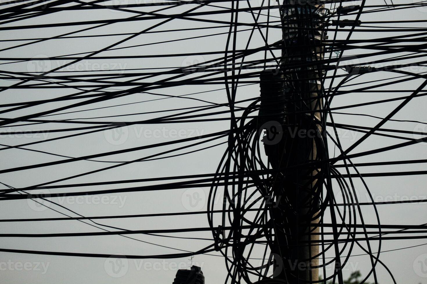 Photo of messy electric poles and power lines
