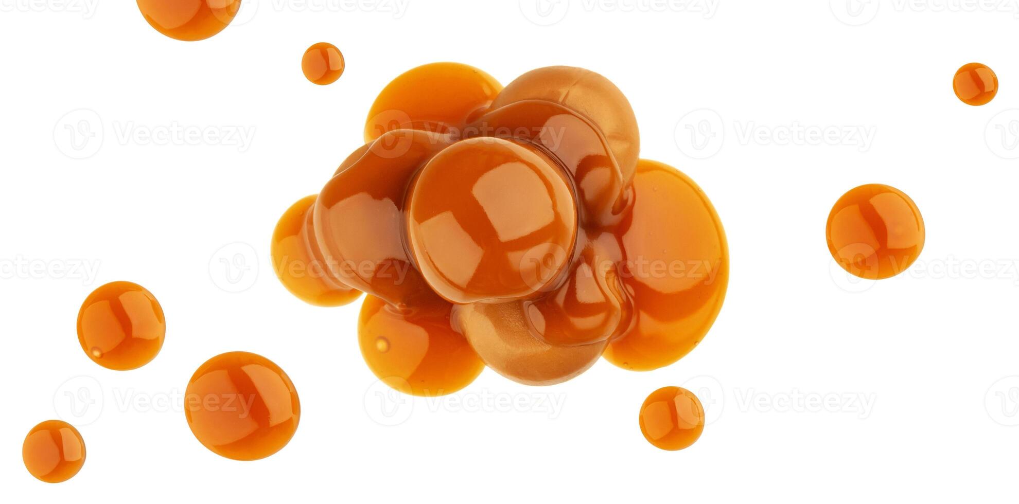 Caramel candies and caramel sauce isolated on white background, top view photo