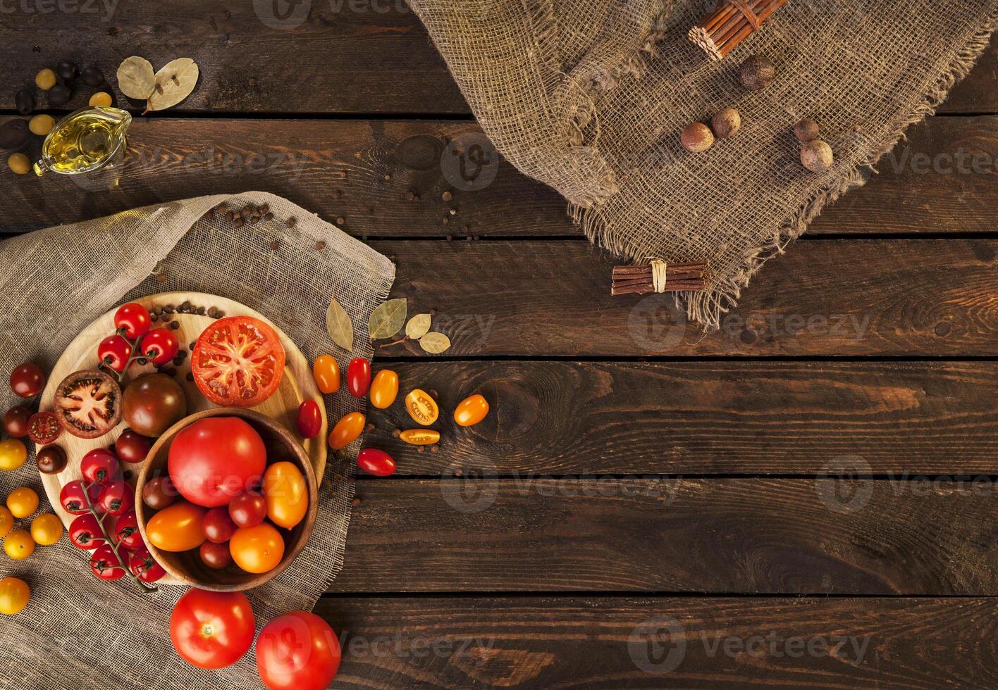 Tomatoes on wooden table, top view photo