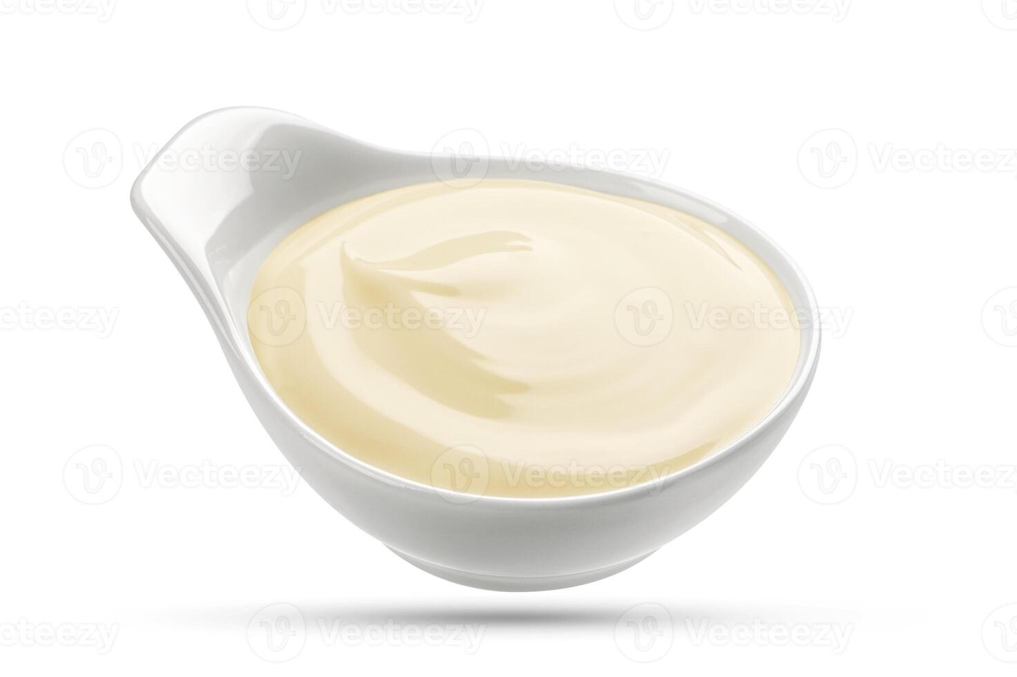 Mayonnaise sauce in bowl isolated on white photo