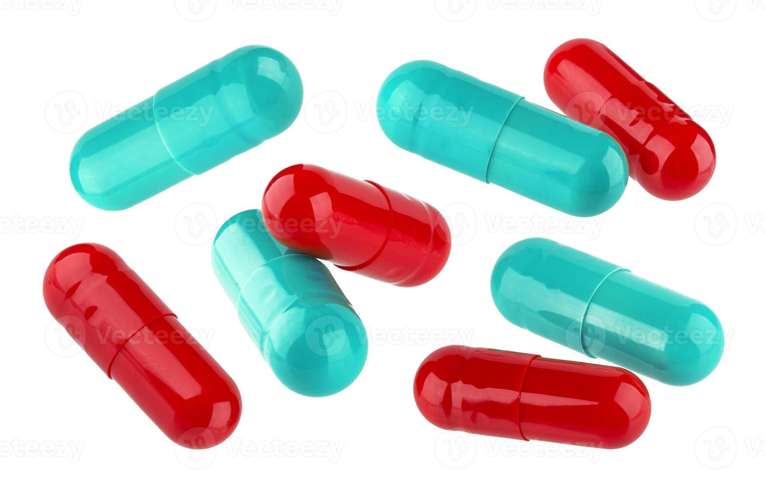 Red and blue medical pill capsules isolated on white background photo