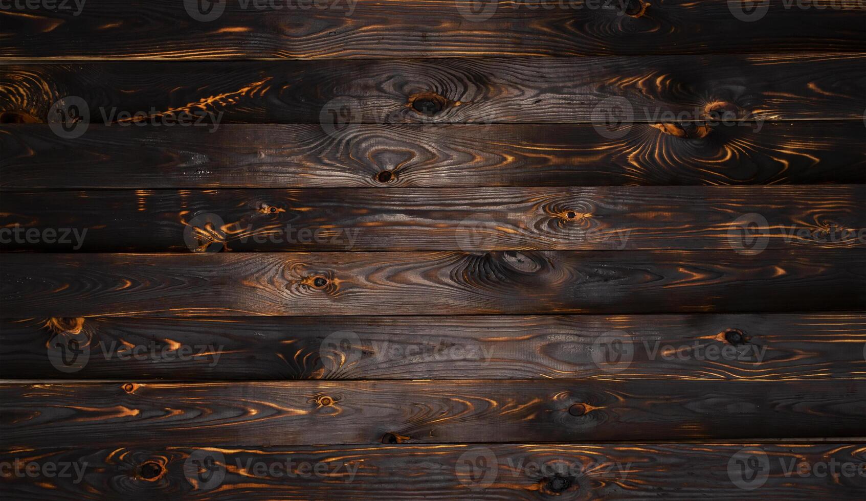 Burnt wooden board, black charcoal wood texture, burned barbecue background photo