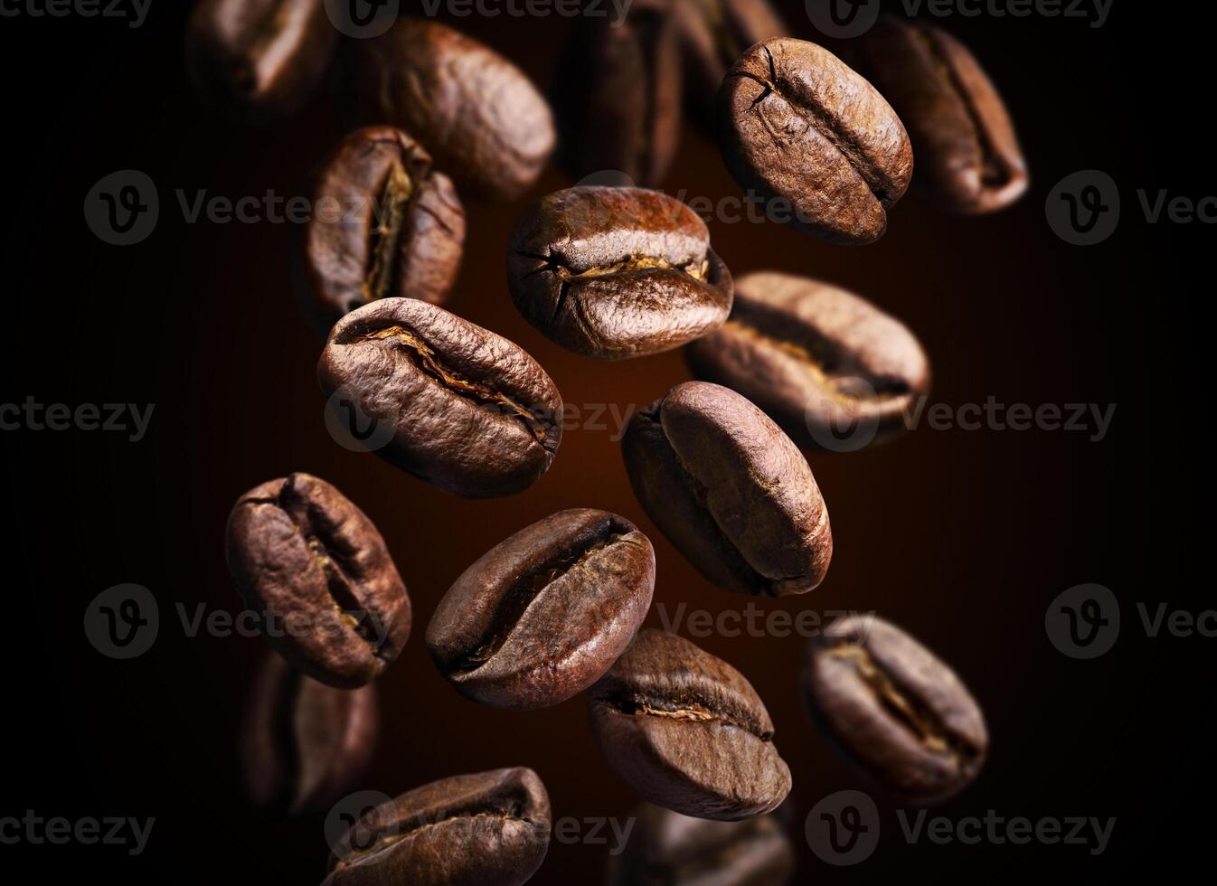 Roasted falling or flying coffee beans on black background, close up, brown texture photo