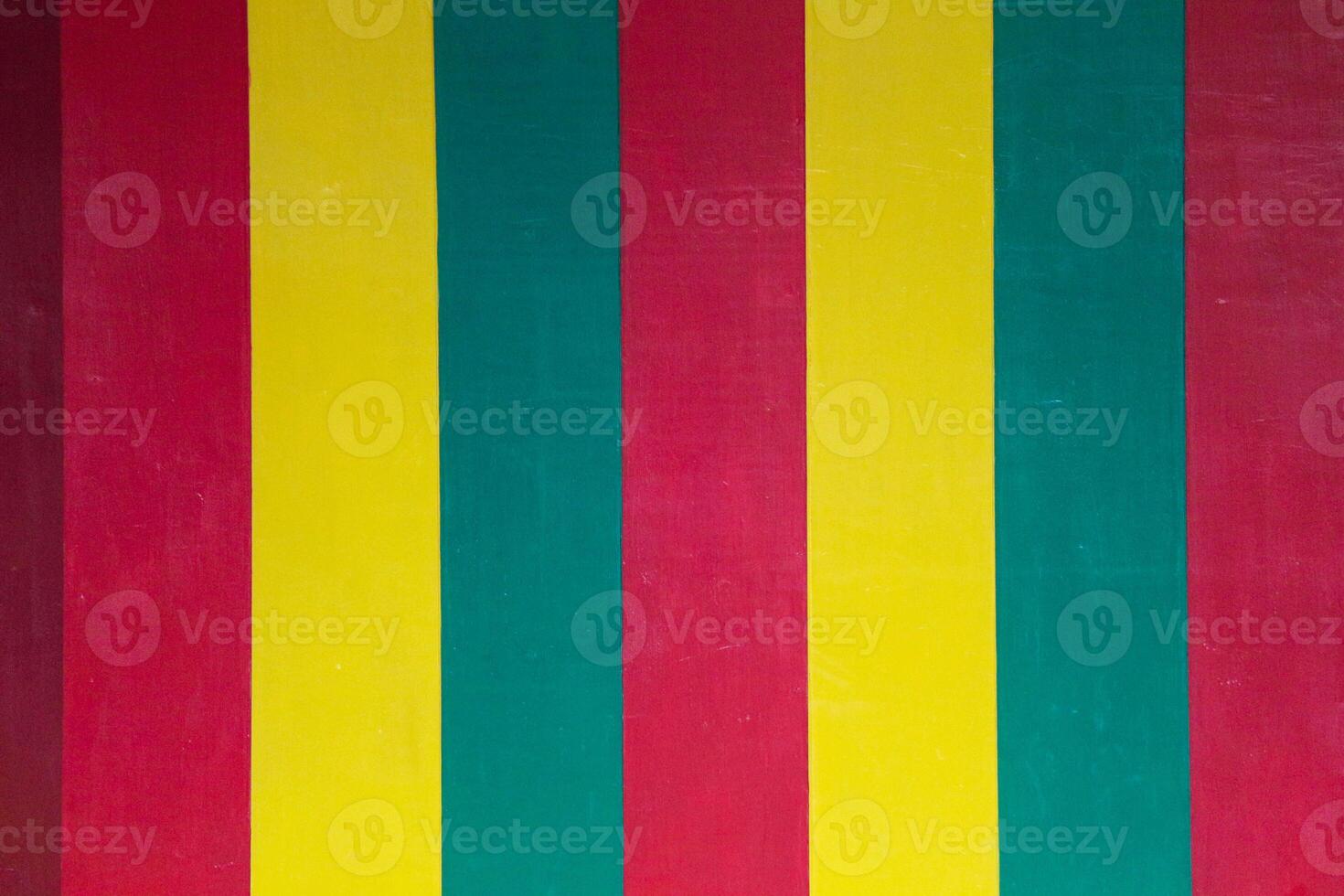 A vertical striped wall in yellow green red which is one of the mainstays of the Aceh Special Pavilion in Taman Mini Indonesia Indah. photo