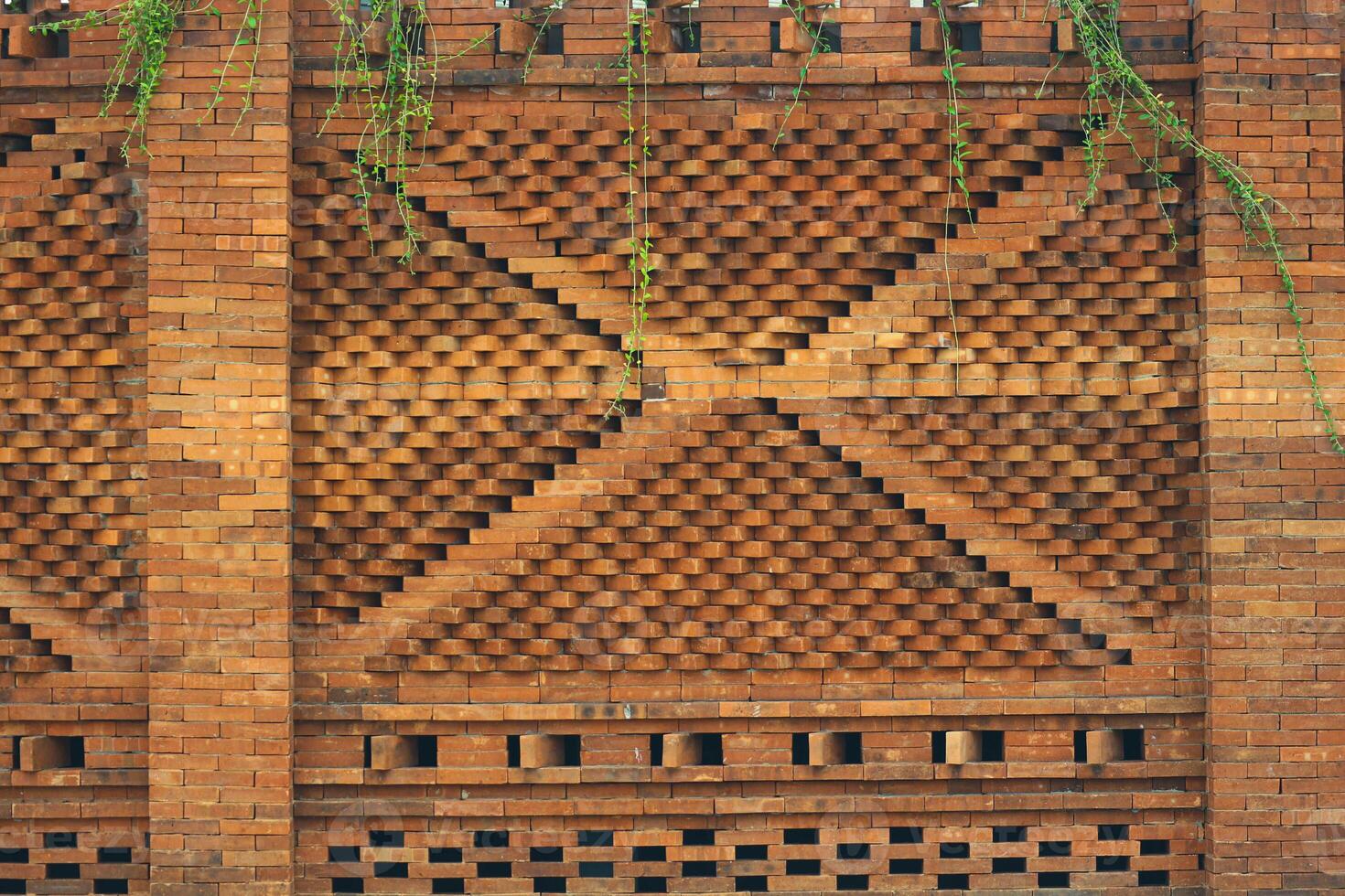 The arrangement of the bricks arranged in such a way forms a very beautiful building wall photo