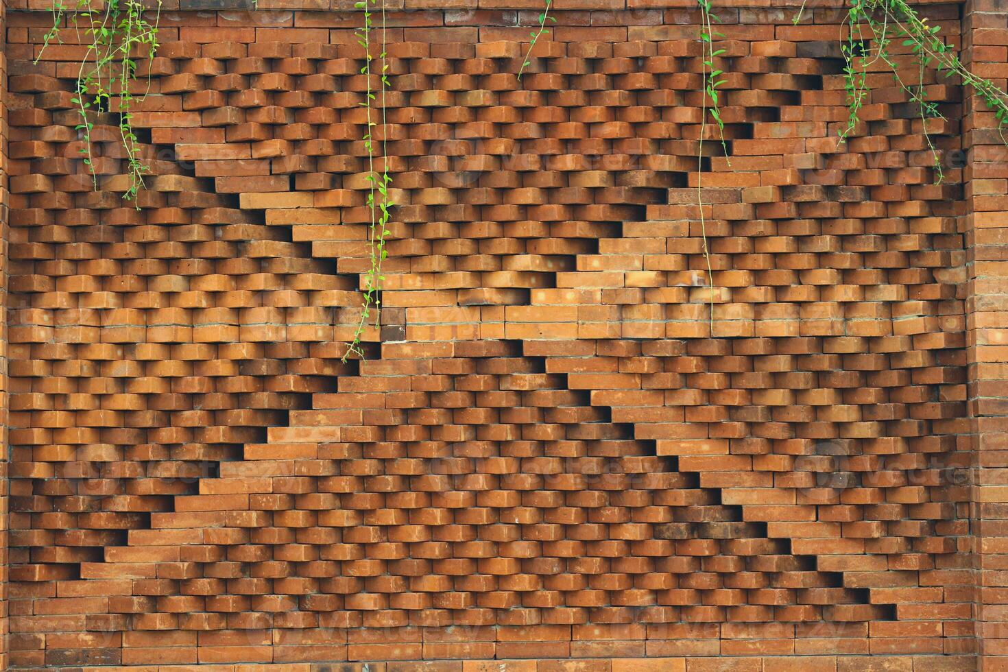 The arrangement of the bricks arranged in such a way forms a very beautiful building wall photo
