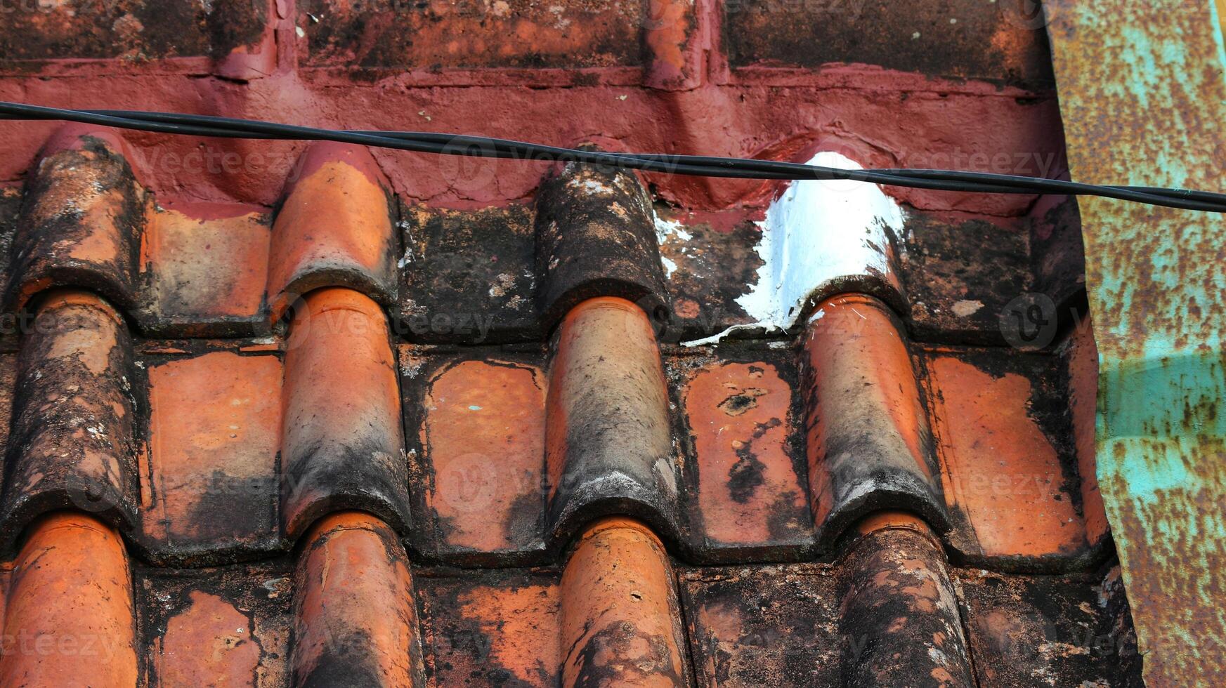 House tiles that are painted are leak-proof so that water doesn't seep in. photo