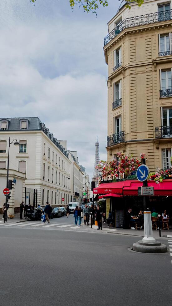 Springtime in Paris with vibrant floral balcony and iconic Eiffel Tower view, captured on April 14, 2024, perfect for travel and holiday themes photo