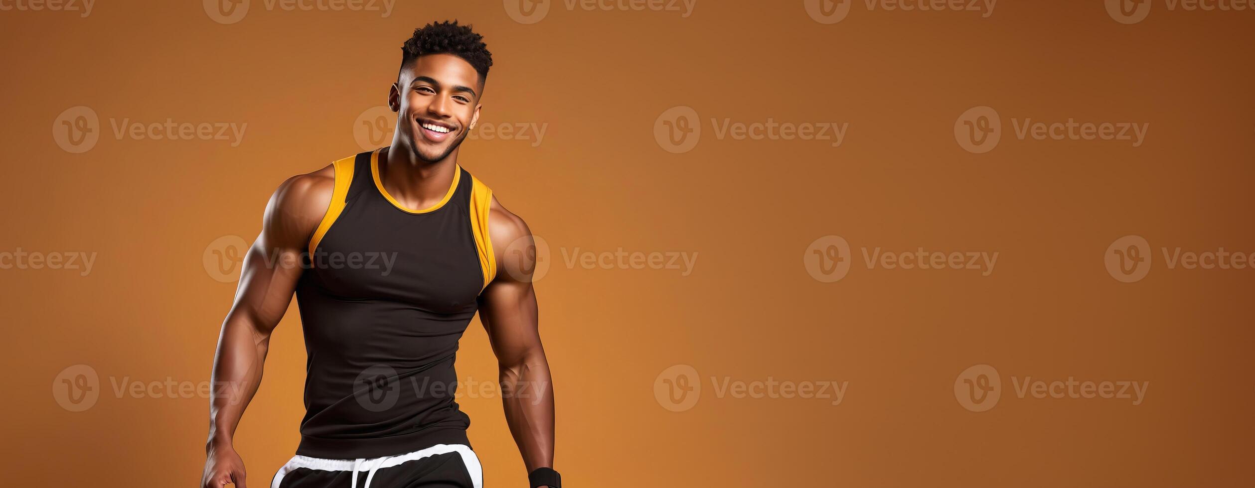 Cheerful African American athlete smiling in sportswear against a warm brown background, embodying health and fitness, perfect for New Year resolutions and gym promotions photo