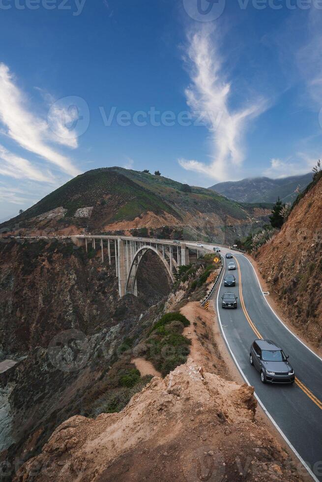 Scenic Coastal Road with Concrete Bridge in Coastal California, USA photo