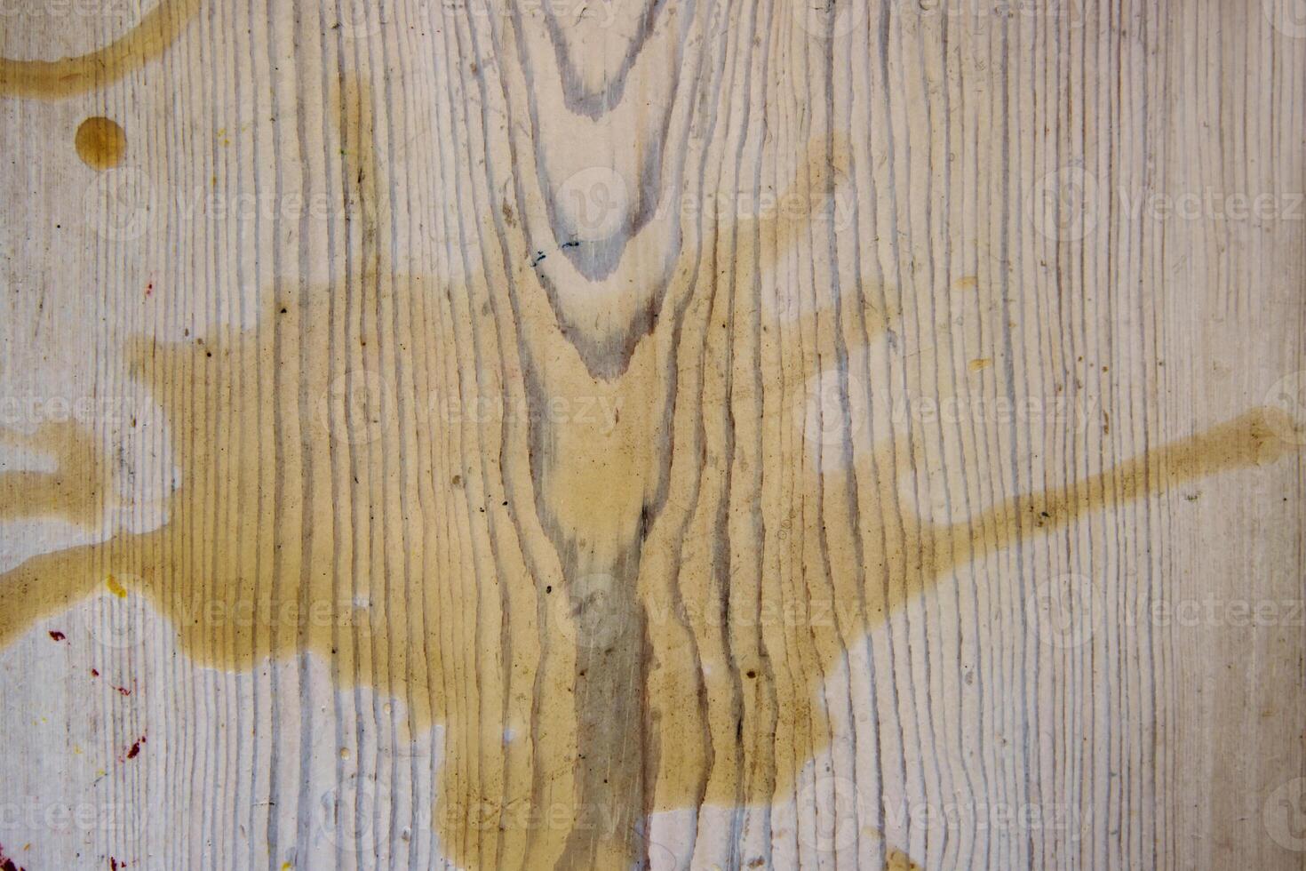 Coffee stains on white wooden table. Wood texture background. Big dark brown dramatic Splatter, fleck, splash, spot, drops of black coffee. Pattern, wallpaper. Top view. Closeup. Copy space. photo