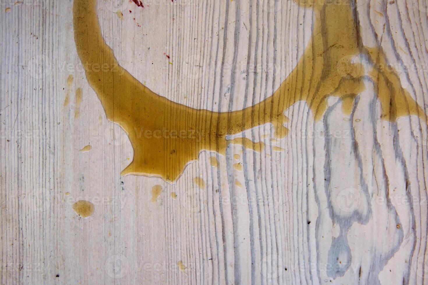 Coffee stains on white wooden table. Wood texture background. Big dark brown dramatic Splatter, fleck, splash, spot, drops of black coffee. Pattern, wallpaper. Top view. Closeup. Copy space. photo