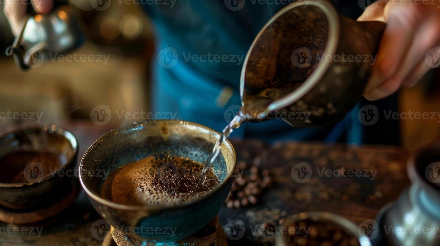 The barista expertly pours a cup of a rich fullbodied coffee made from beans grown in the volcanic soil of a secret island photo