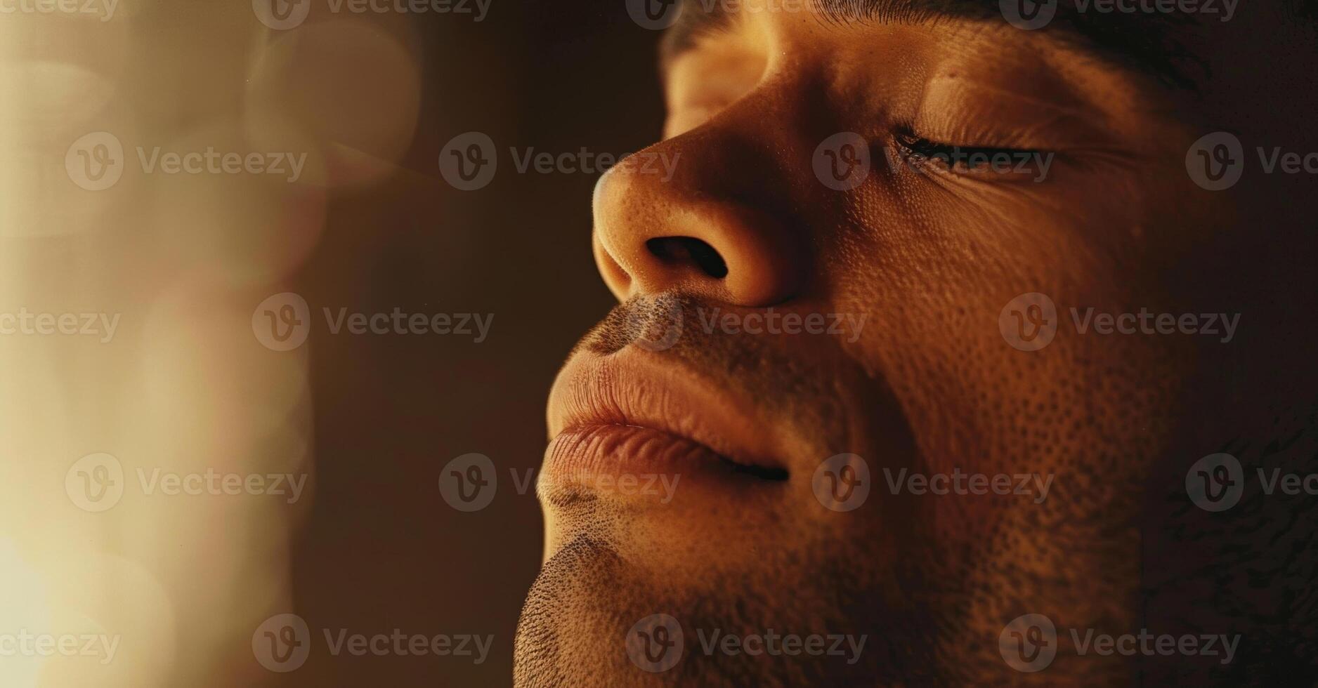 A man takes deep breaths and practices relaxation techniques as he works through intense emotions in therapy photo