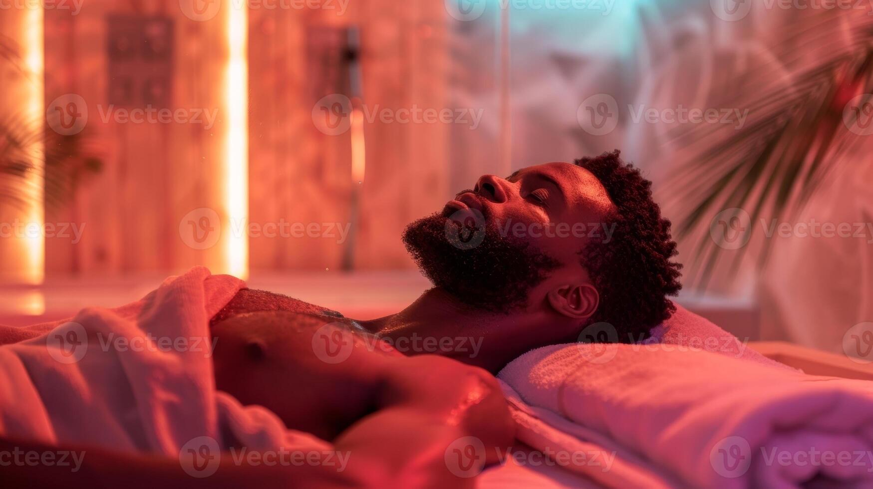 A traveler relaxing on a towel taking in the theutic benefits of the sauna after a long journey. photo