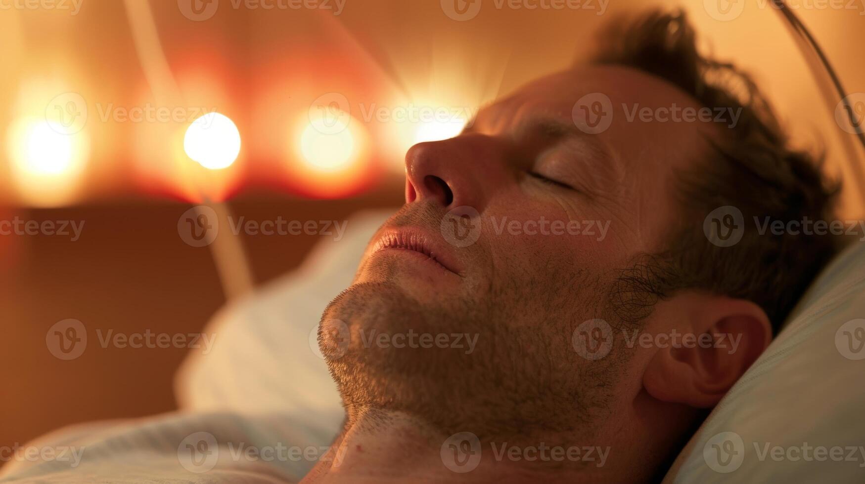 A man participating in a sound therapy session allowing the soothing vibrations and frequencies to aid in his healing process at a mens retreat photo