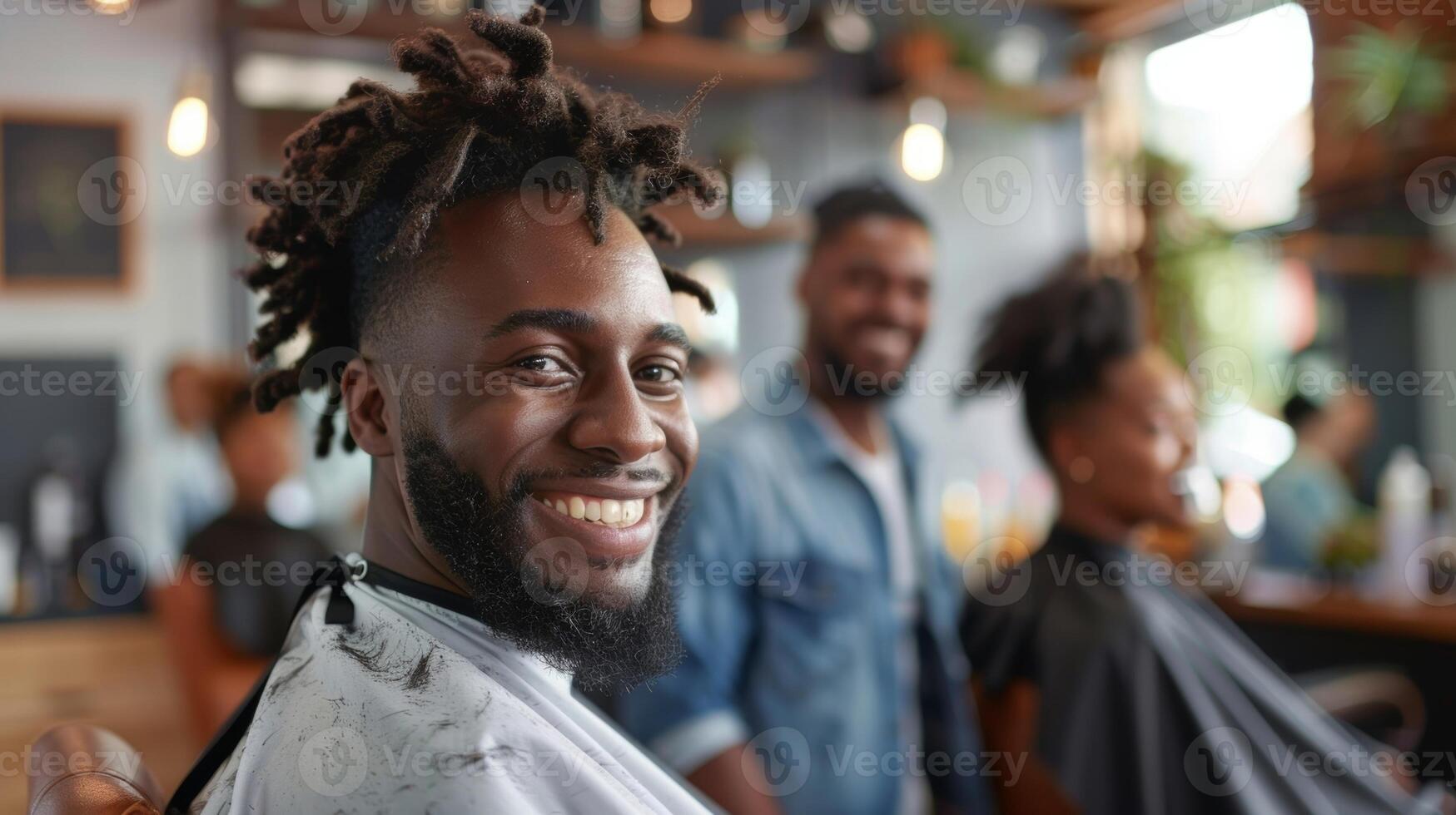 A customer getting a fresh hair and proudly showing it off to his friends with a big smile photo