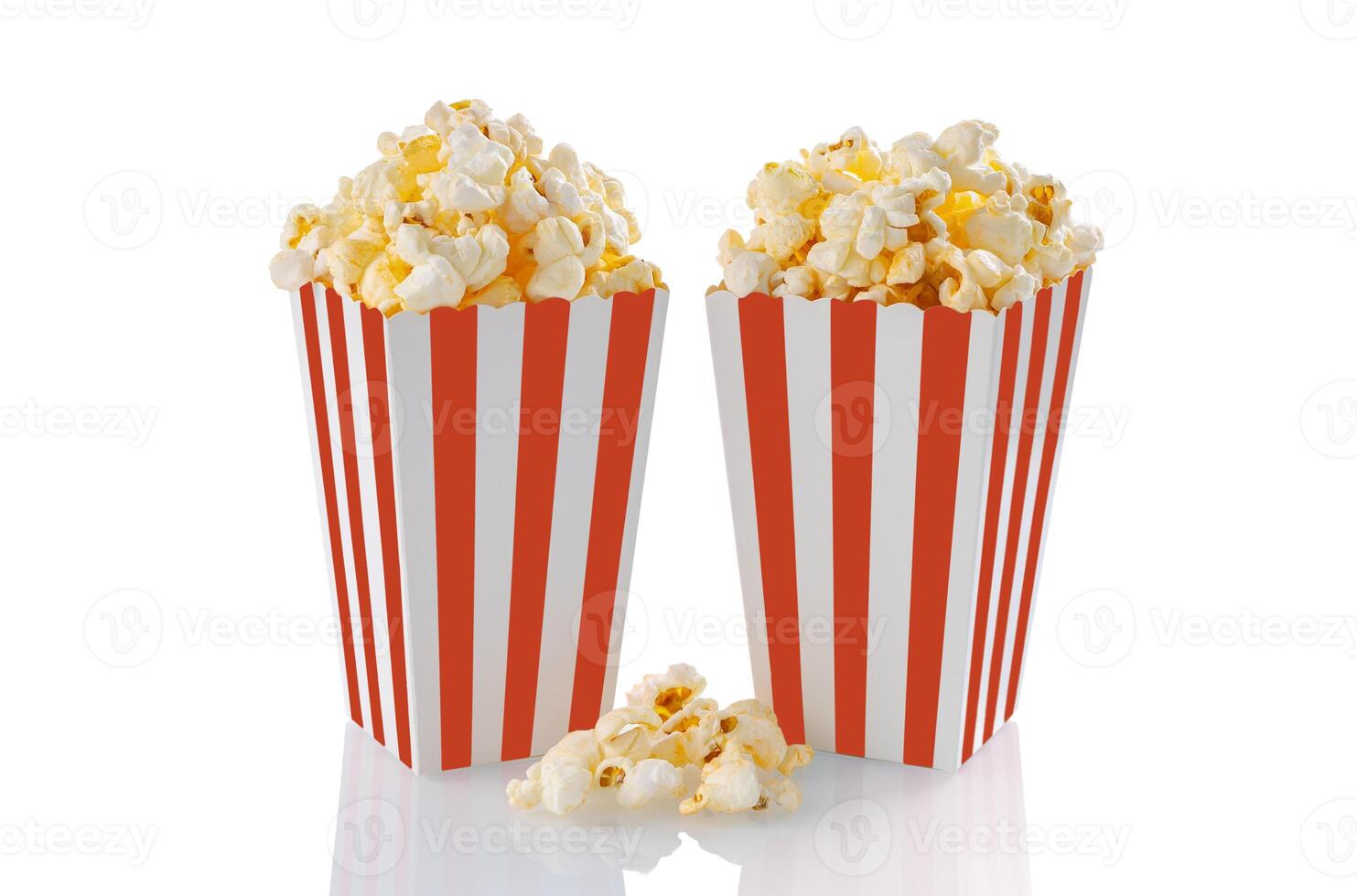 Two red white striped carton buckets with tasty cheese popcorn, isolated on white background photo