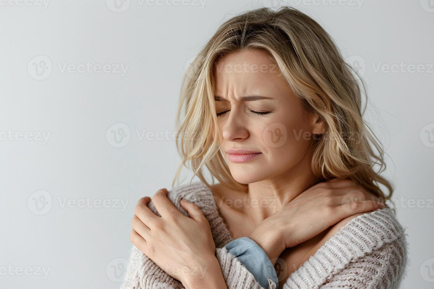Young Woman Experiencing Shoulder Pain and Discomfort photo