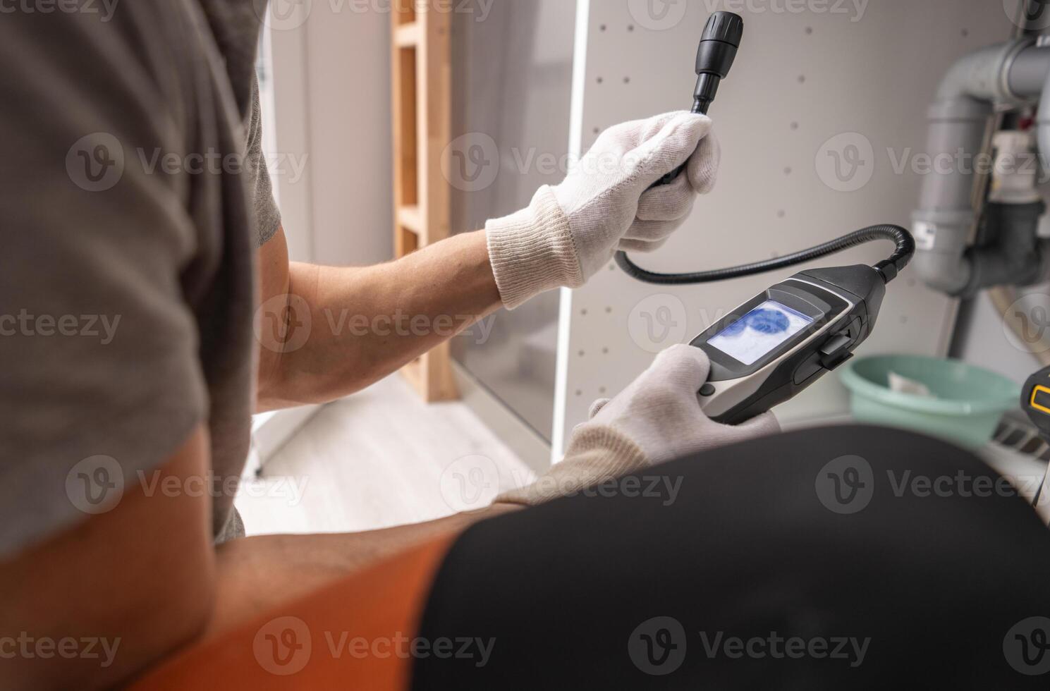Technician with Gas Detector in His Hands photo