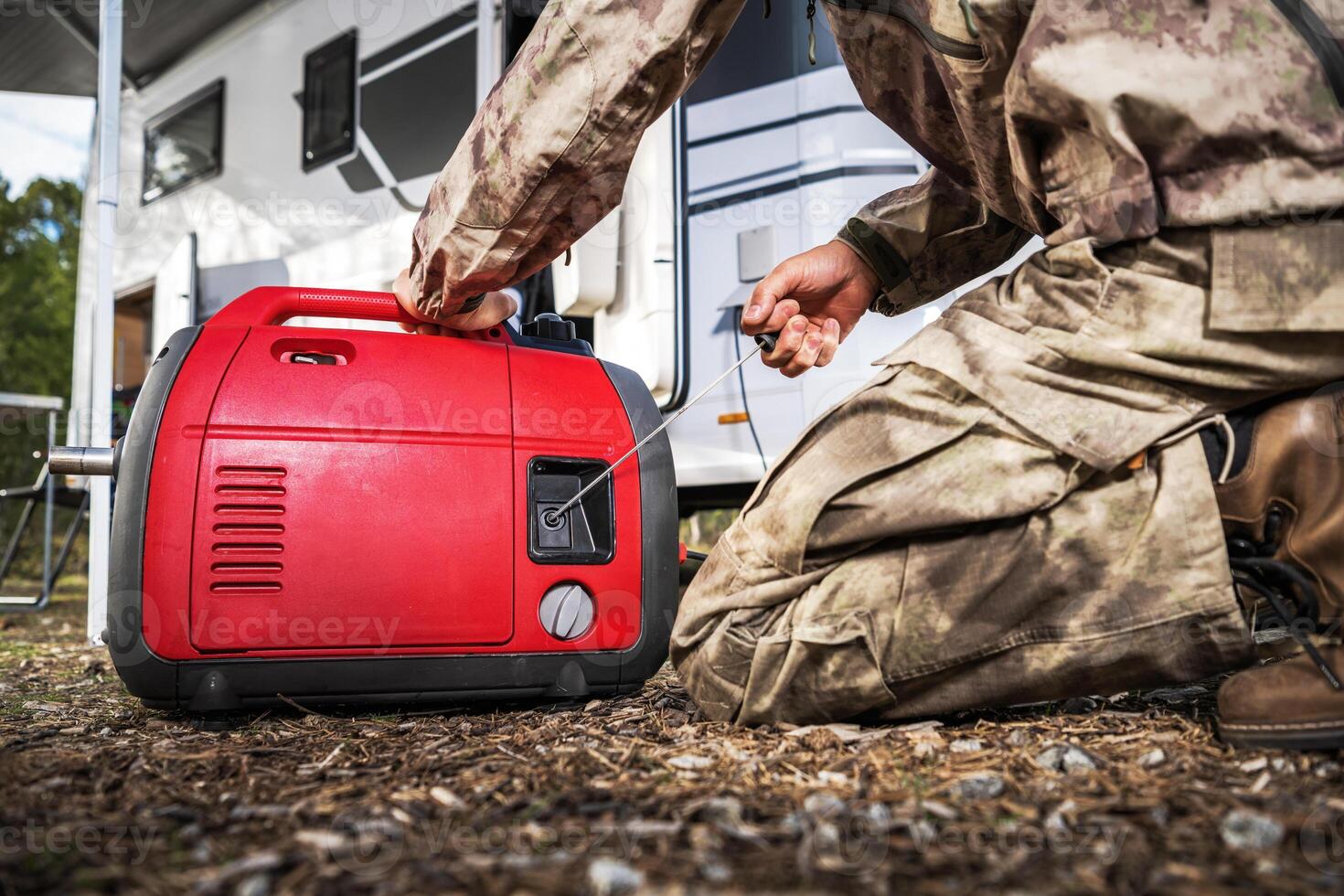 RV Owner Firing Portable Electricity Generator photo