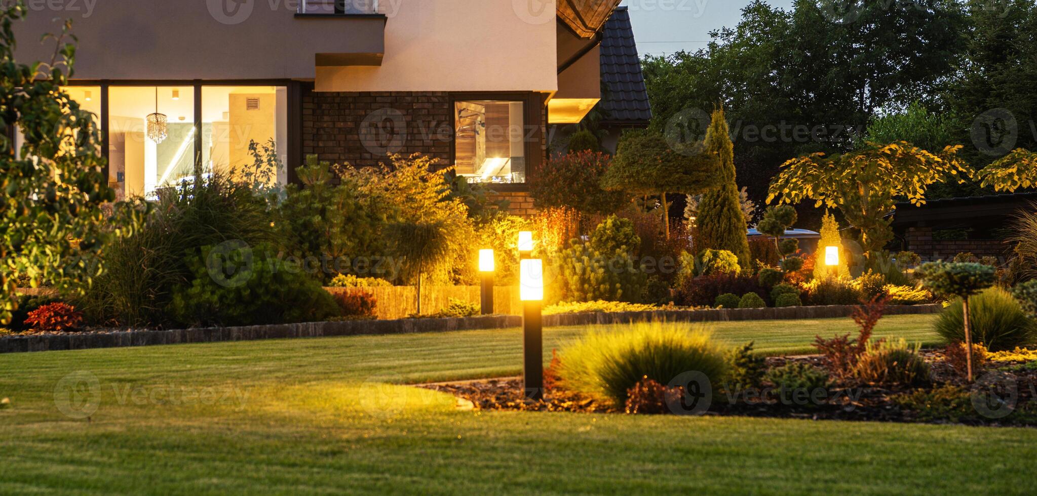 Modern LED Garden Light Posts. Residential Backyard Garden photo