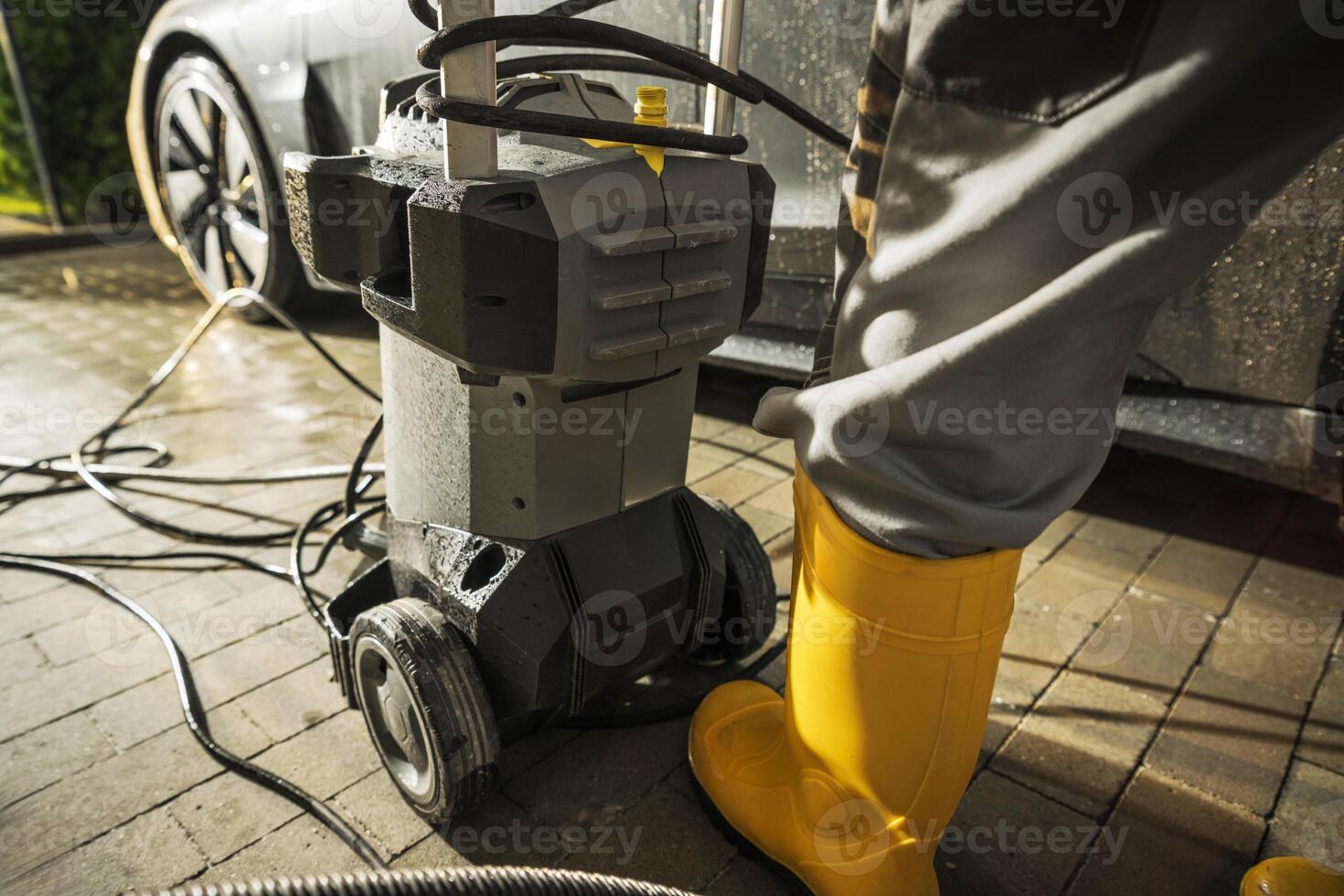 Using Modern Pressure Washer to Wash a Car photo