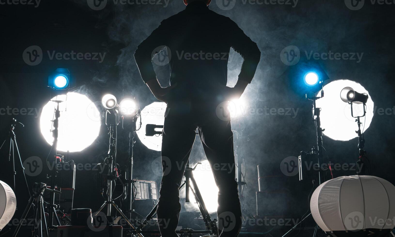 Photo Studio Worker In Front of Lighting