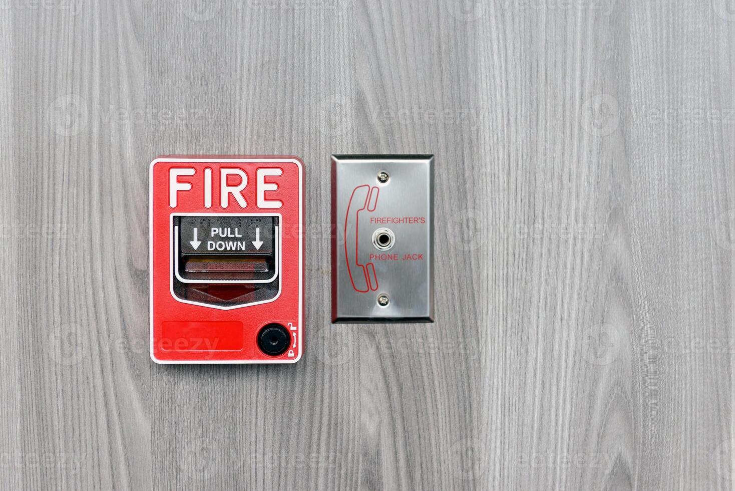 Fire alarm switch box on wall for warning with copy space photo