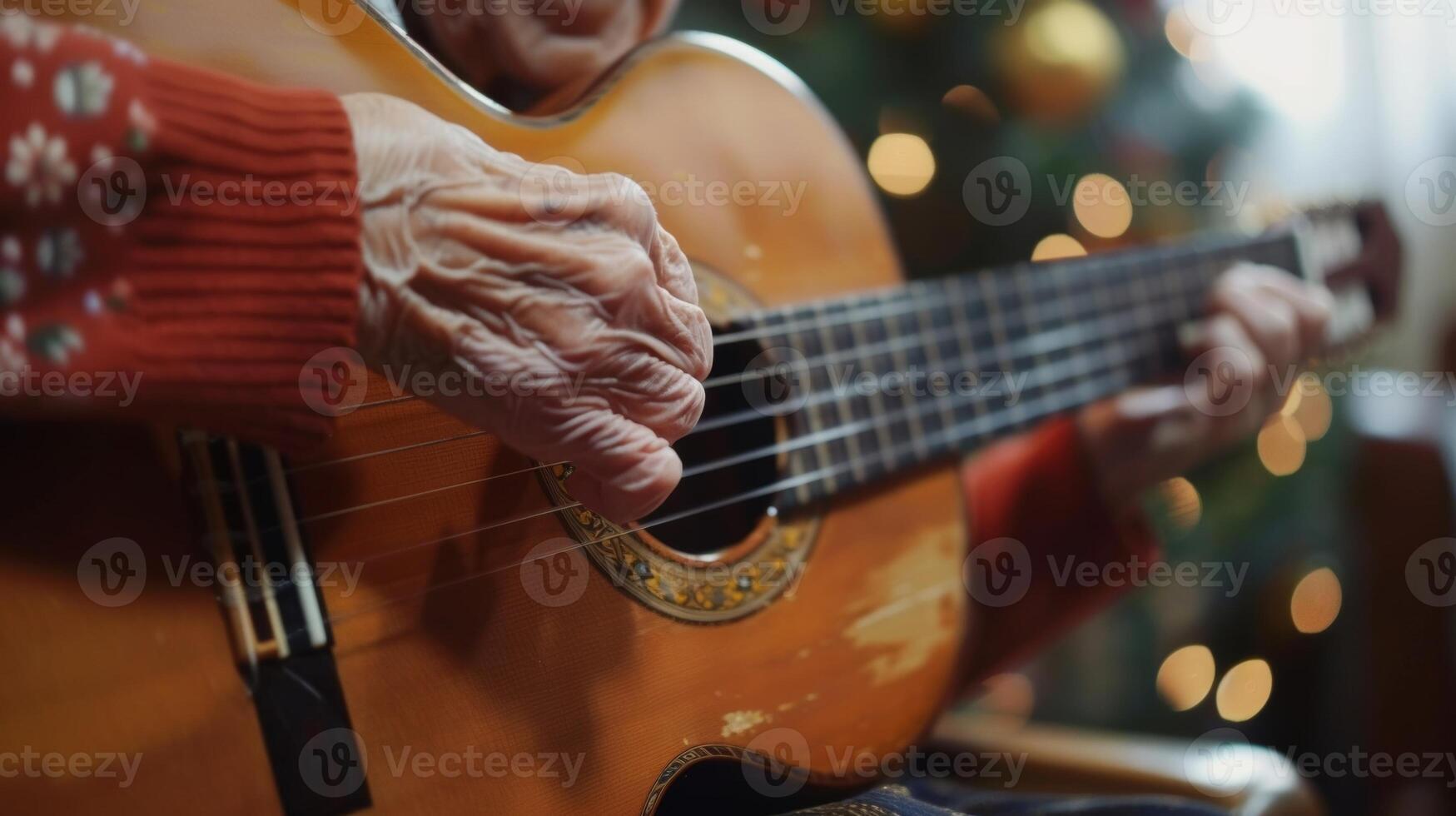 A grandma pulls out her guitar and begins to strum a familiar tune photo