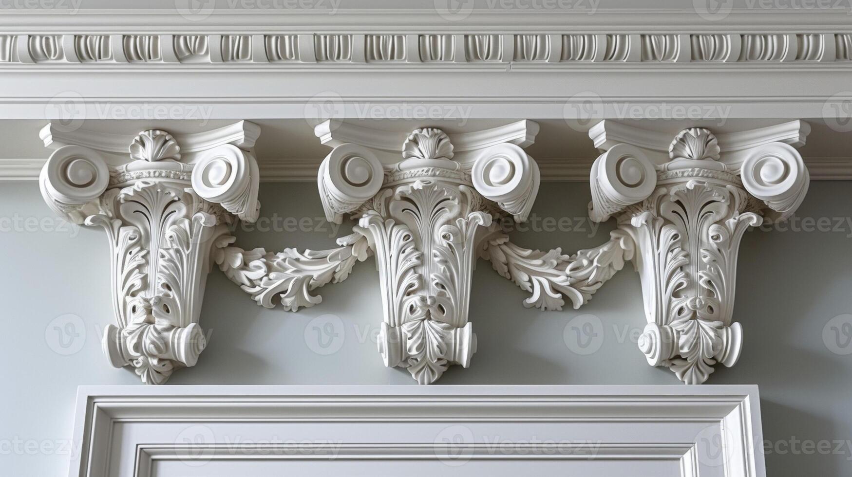 A detailed view of delicate molding and trim work above a doorway adding a touch of elegance to an otherwise plain wall photo