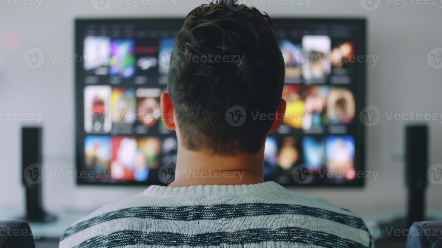 A man watching a funny movie or TV show using humor as a way to lift his spirits and improve his mood photo