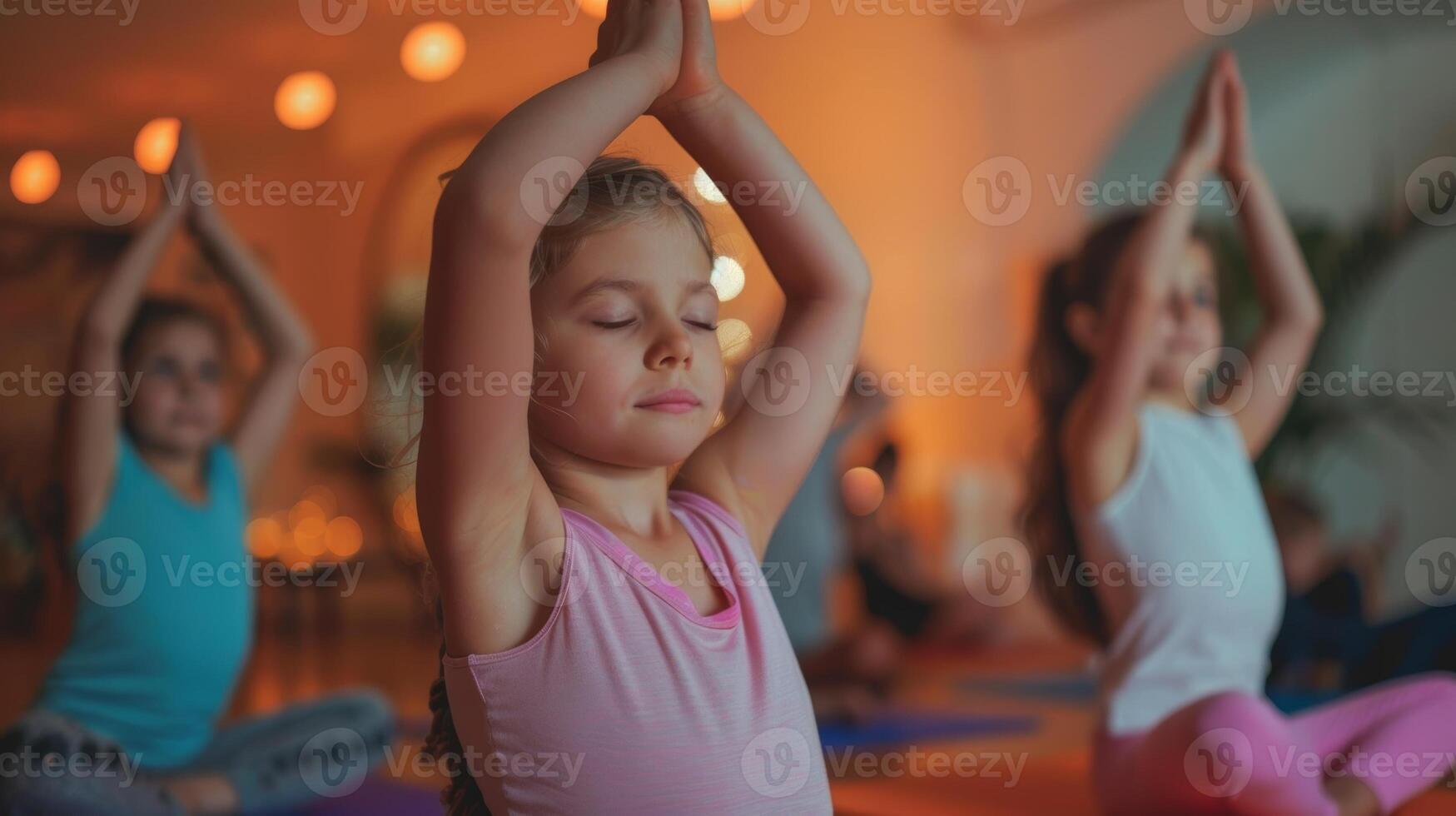 Children and parents participate in a yoga session stretching their bodies and minds together photo
