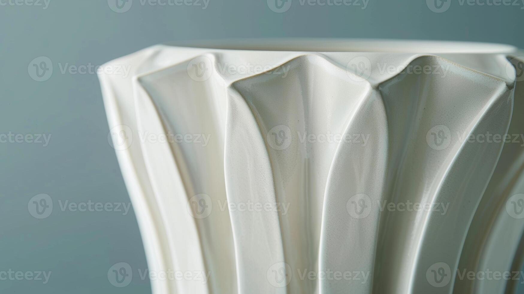 A sculptural ceramic vase with a geometric modern design inspired by the clean lines and shapes of Art Deco architecture. photo