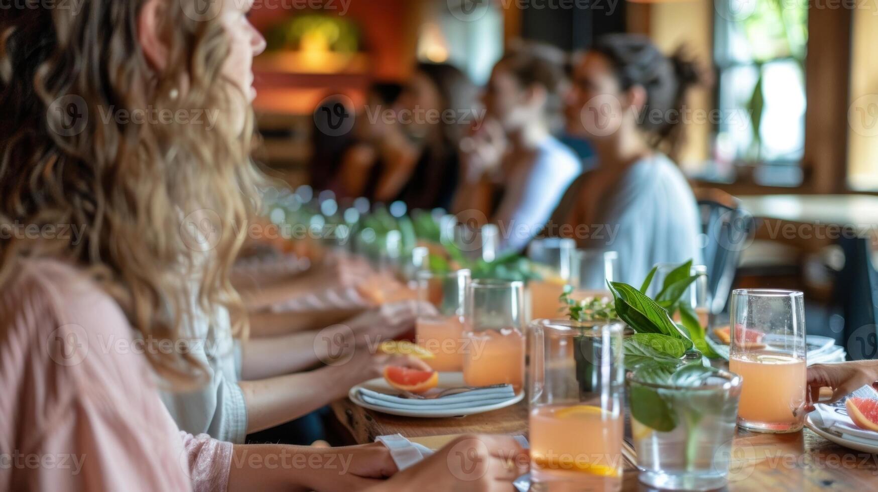 A yoga class ends with a mindful mocktail meditation where participants gather around a communal table slowly drinking their beverages while a guide leads them through a visualizatio photo