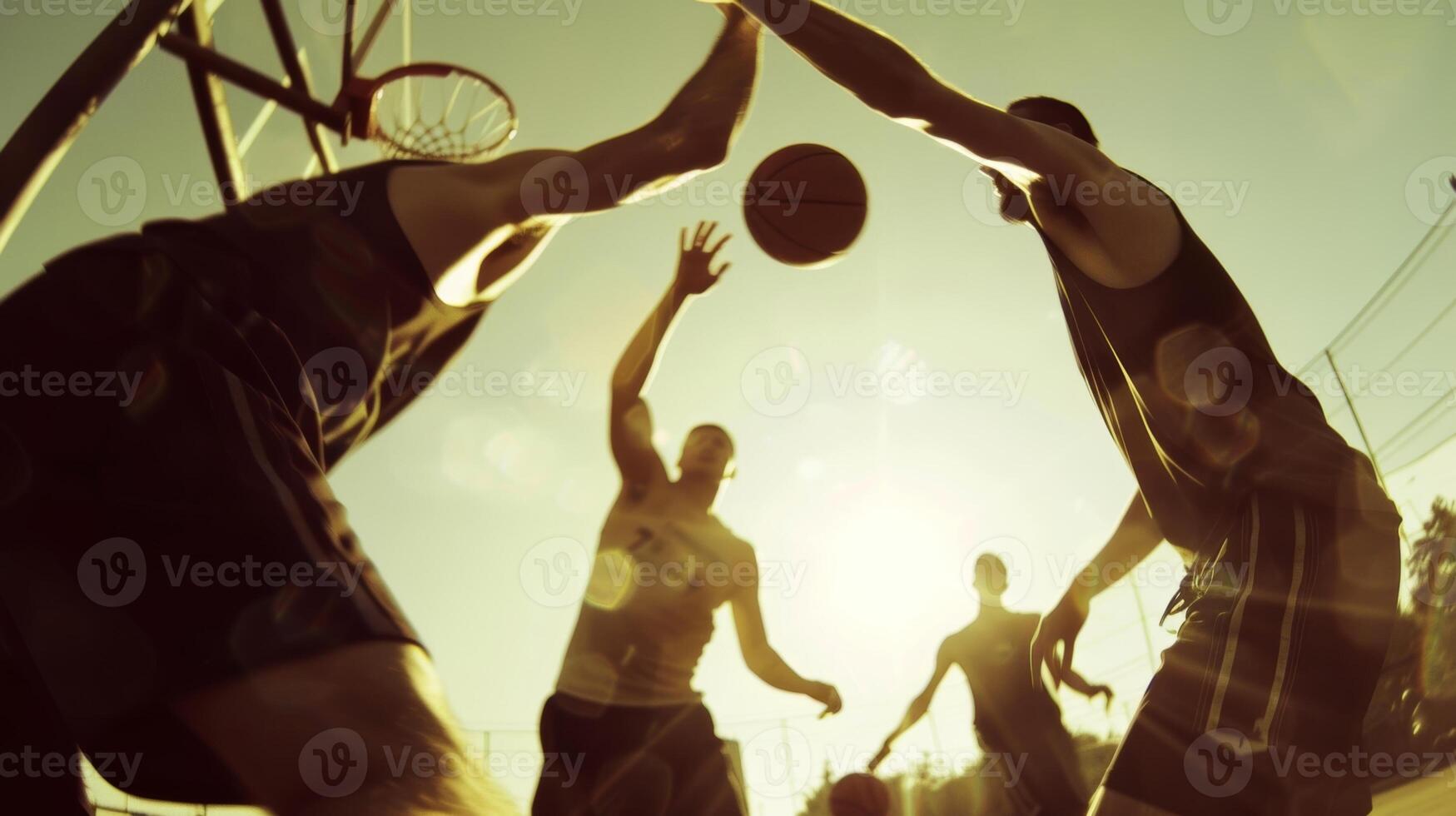 A group of individuals engaging in a intense game of basketball sweating and working hard without the crutch of alcohol photo