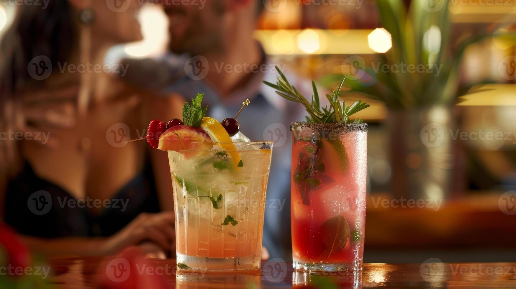 A couple enjoys a quiet evening at the nonalcoholic bar sipping on mocktails garnished with fresh fruits and herbs photo