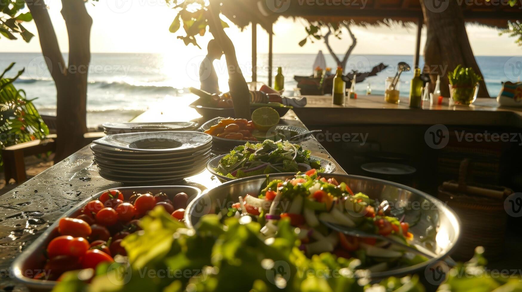 The tropical sun shines down on the beachside counter as the salad is being prepared photo