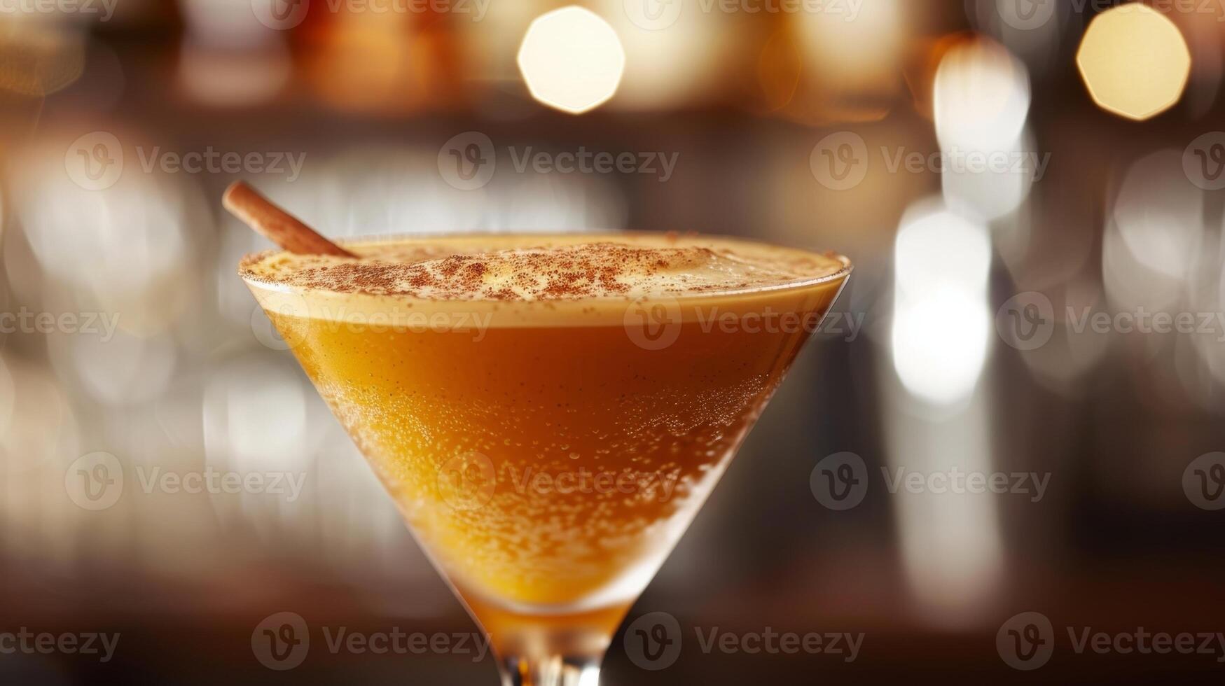 A mocktail bartender gives a tutorial on how to make a delicious pumpkin e martini without the alcohol using ingredients like pumpkin puree and cinnamon photo