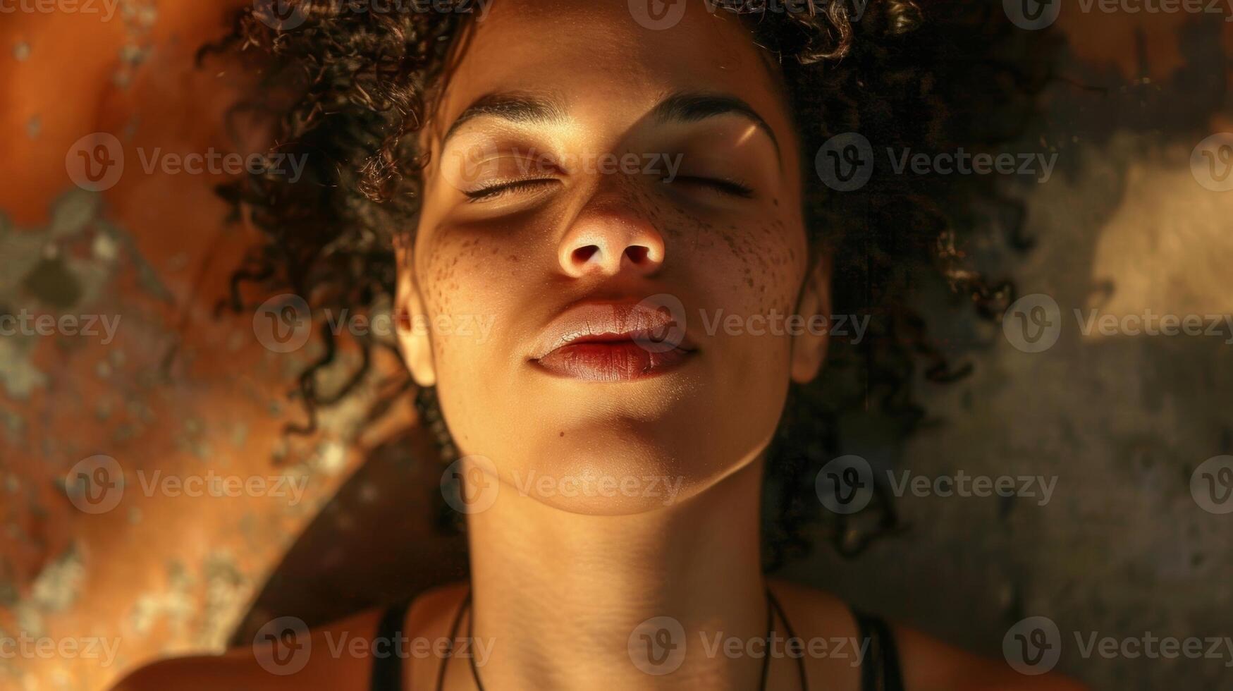 A woman dances with closed eyes fully immersed in the music and movement photo