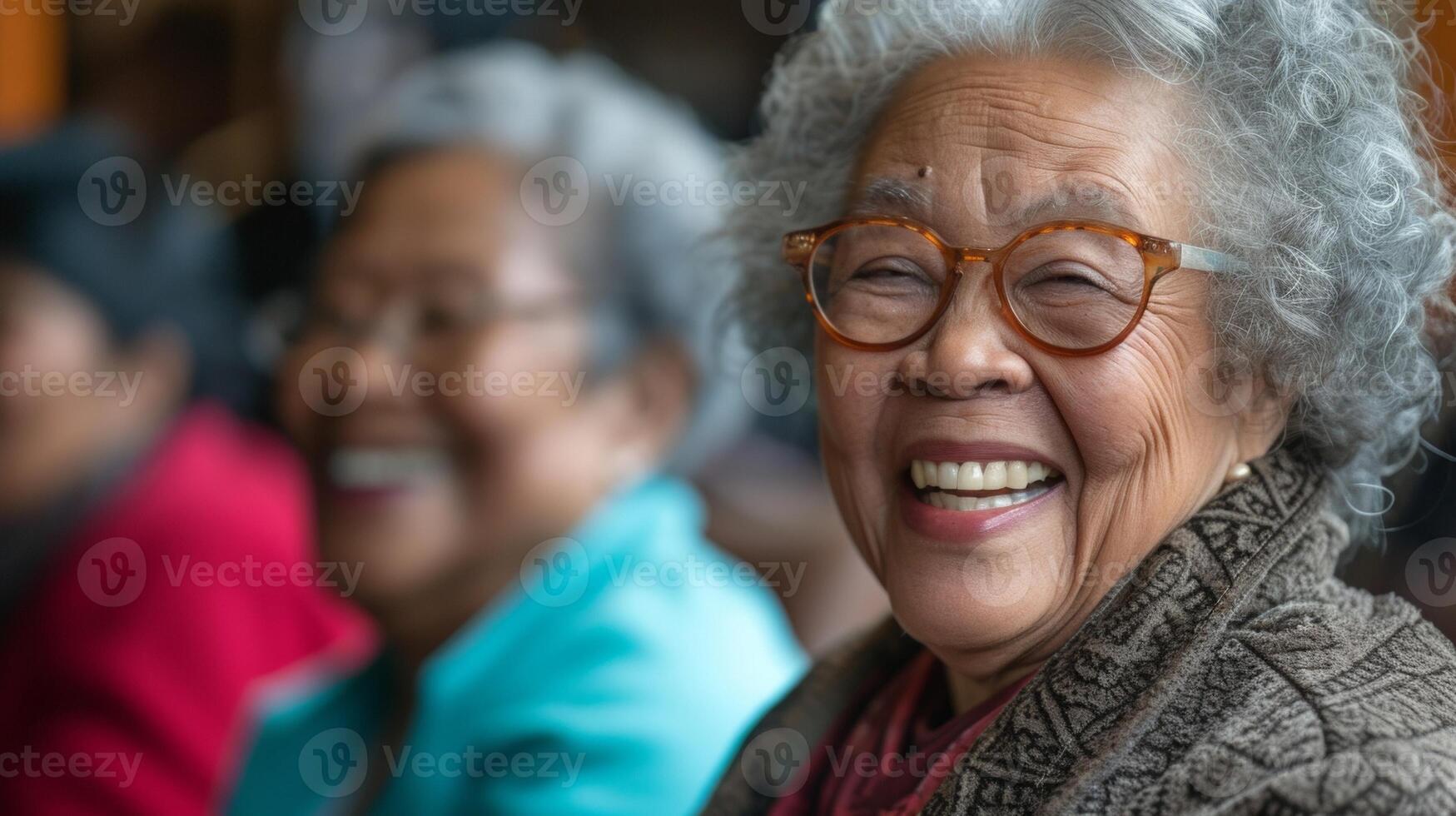 A warm and welcoming scene of older adults sharing a moment of pure laughter and connection in a laughter yoga class photo