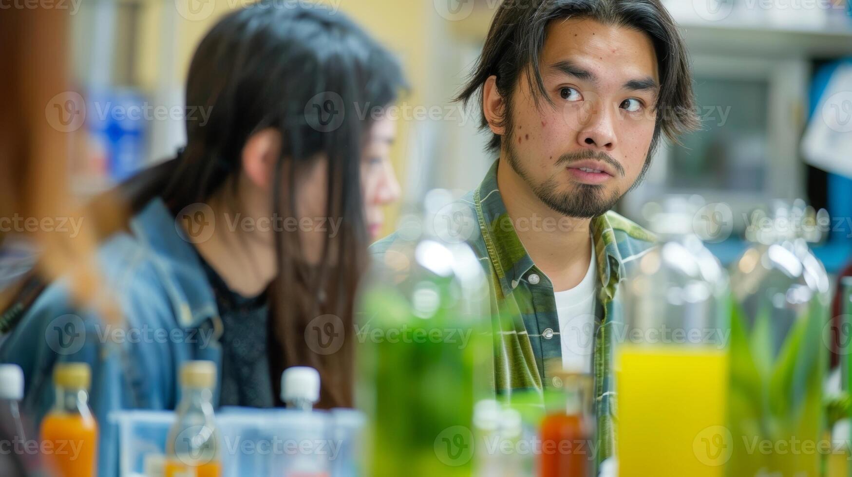 A participant looks anxious as they present their exotic juice blend to the judges hoping it will impress them photo
