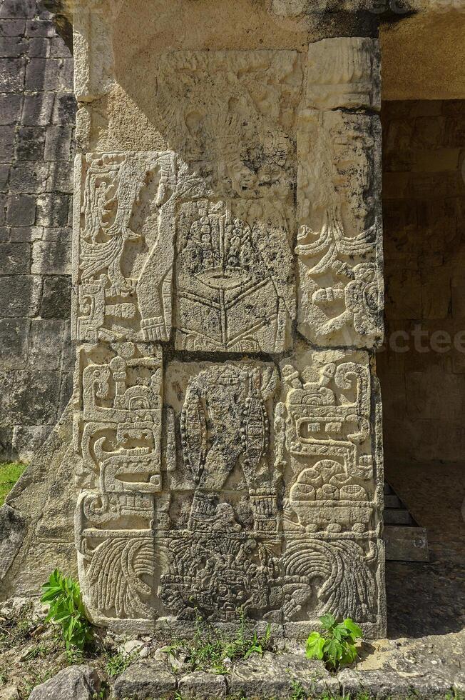 Stele with Mayan inscriptions in Chichen Itza photo