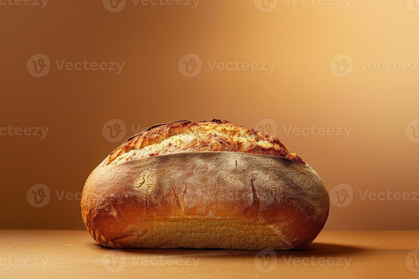 Artistic shot of a freshly baked loaf of bread on a smooth gradient background, transitioning from dark to light brown photo