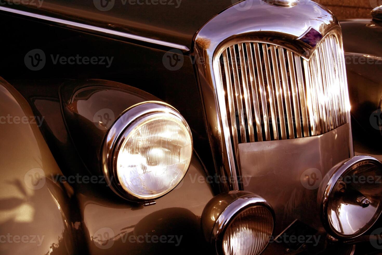 The front grill and headlight of the old beautiful car on the background copy space, card background photo