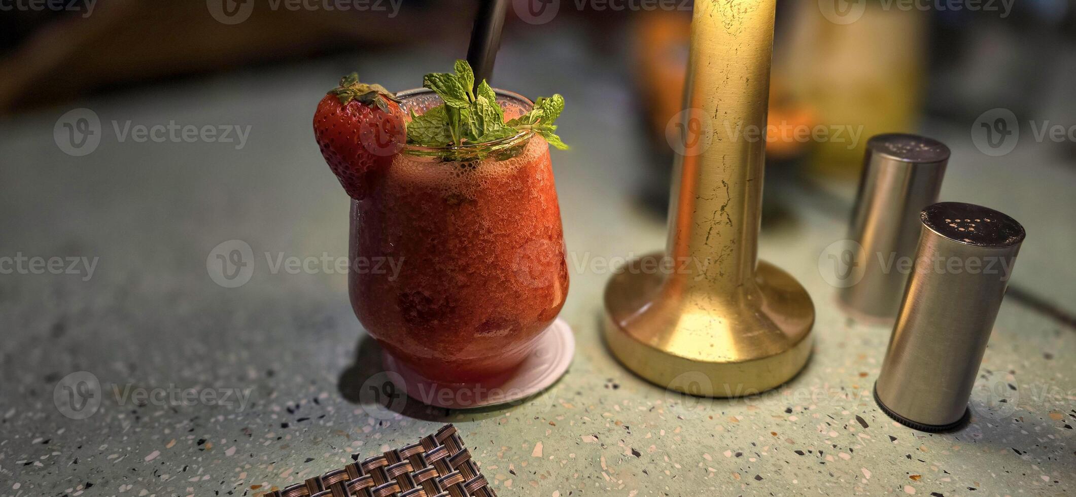 Fruit cocktail smoothie diet detox, tropical fruit summer cocktail with garnish, and ice on restaurant background photo