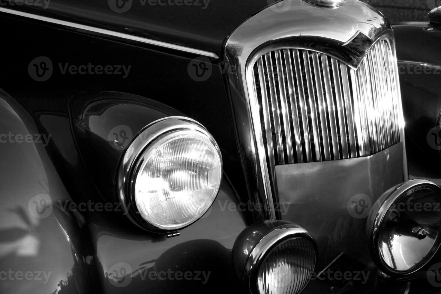 The front grill and headlight of the old beautiful car on the background copy space, card background photo